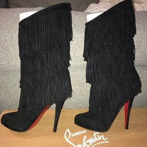 Christian Louboutin black fringe boots.